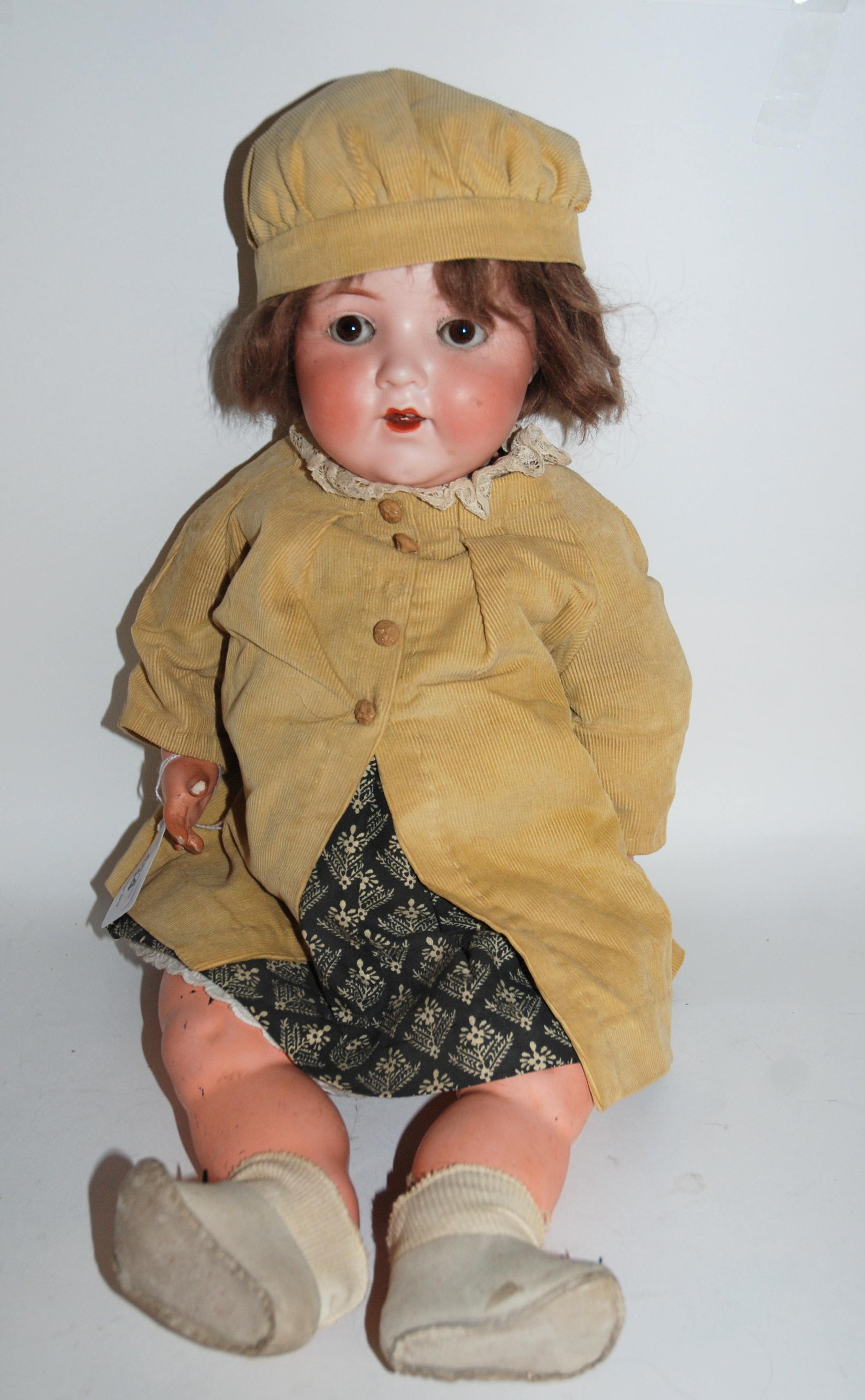An Armand Marseille 995 bisque-headed doll with open and close brown eyes, open mouth and painted