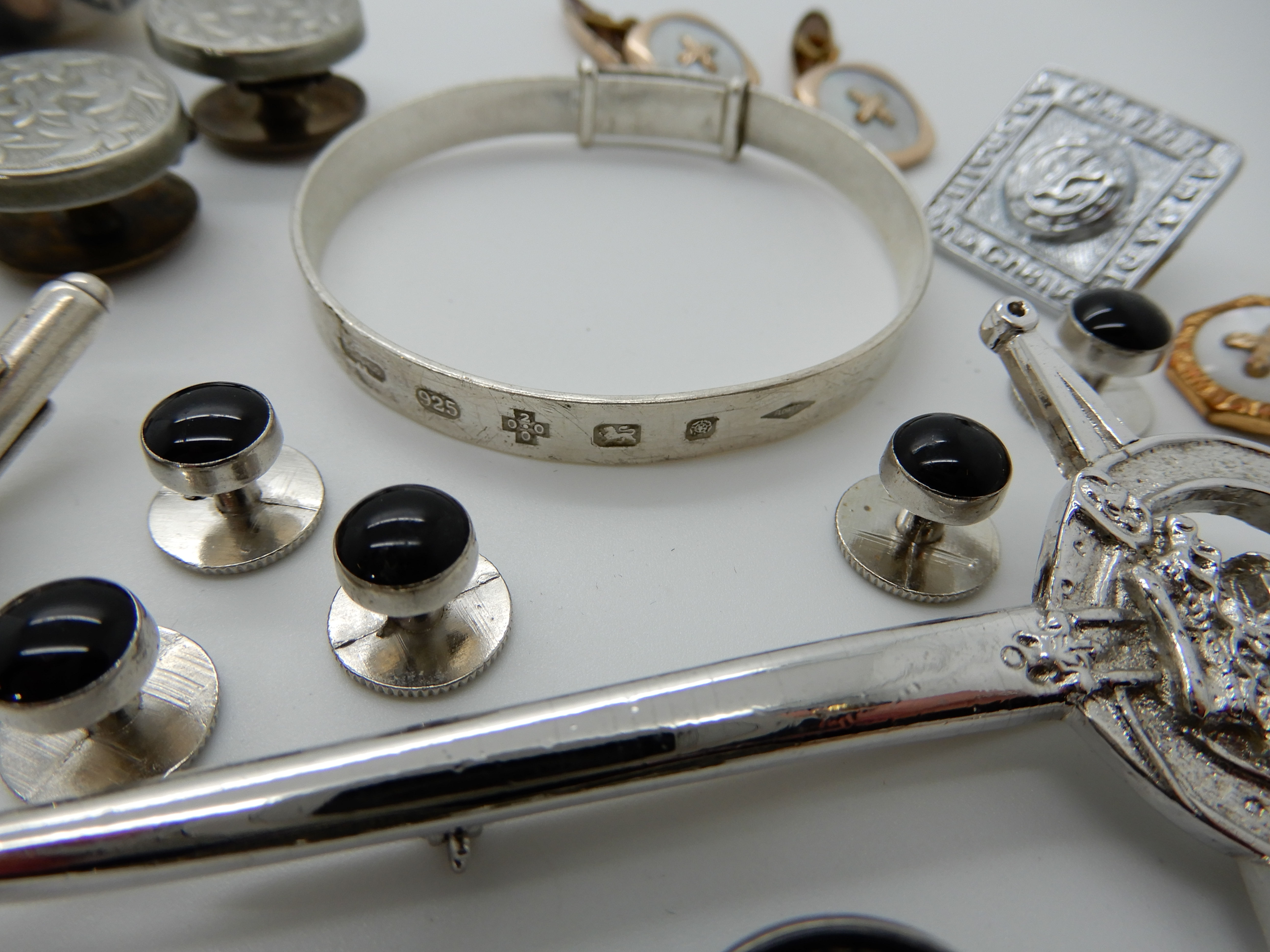 A silver bangle, a collection of silver and costume jewellery cufflinks etc Condition Report: Not - Image 4 of 4