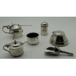 A lot comprising four assorted mustard pots, salt and pepper, a silver inkwell, Birmingham 1946