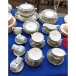 A Simpson's Haslemere pattern dinner service comprising dinner plates, side plates, pudding bowls,