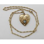 A 9ct gold fancy neck chain with a gold plated heart shaped locket, length of the chain 45cm, weight