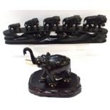 A carved ebony lion bridge together with an ebony elephant on a stand Condition Report: Available