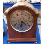 A mahogany bracket clock with silvered face and Roman numerals, the movement marked 1070376