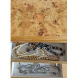 A decorative jewellery box full of costume jewellery, multi coloured cultured pearl necklace, silver