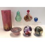 An unsigned John Ditchfield glass pear, 13.5cm high, a smaller apple, two art glass paperweights and