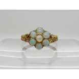 A 9ct gold opal flower cluster, size M1/2, weight 2.5gms Condition Report: Available upon request