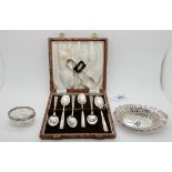 A lot comprising a cased set of six silver teaspoons with tongs, Sheffield 1940, a silver bon bon