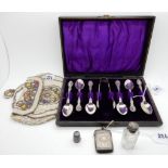 A lot comprising a cased set of six EP teaspoons with tongs, a beaded purse, scent bottle, vesta and