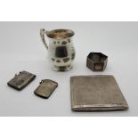 A lot comprising a silver christening mug, Birmingham 1938, a silver cigarette case, two vestas