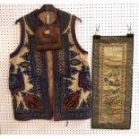 An Eastern European embroidered waistcoat, a leather bag and a Chinese silk panel Condition