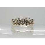 A 14k gold diamond cluster ring, set with estimated approx 0.20cts of brilliant cut diamonds, size