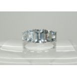 A 9ct white gold aquamarine five stone ring, size S1/2, 2.6gms Condition Report: Available upon