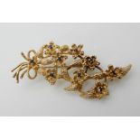 A 9ct gold sapphire flower brooch, length 6.2cm, weight 10.7gms Condition Report: Available upon