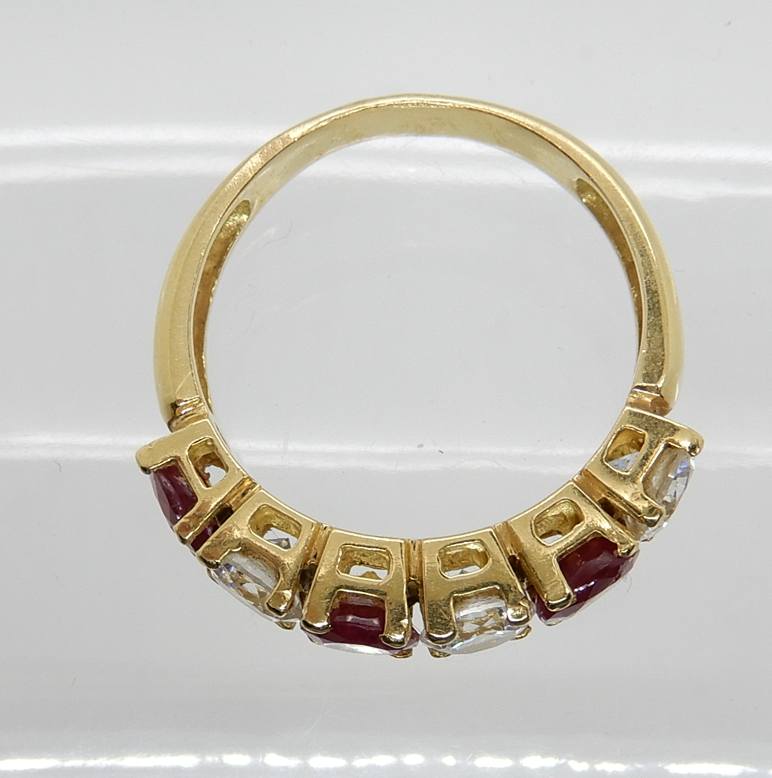 A continental bright yellow metal ruby and clear gem ring, size P, weight 5gms Condition Report: - Image 2 of 3