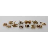 A collection of 9ct gold and yellow metal earrings to include three pairs set with sapphires, pearls