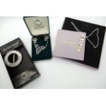 A silver and 9ct gold detail pendant, pendant and earring set and rune scarf brooch all by Ola Gorie