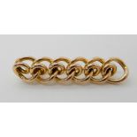 A 15ct gold knot design brooch length 4.8cm, weight 5.5gms Condition Report: Available upon request