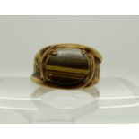 A 9ct gold tigers eye ring, size T1/2, weight 6.2gms Condition Report: Available upon request