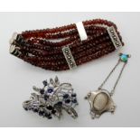 A Silver and garnet bracelet, a Charles Horner pendant (af) and a brooch Condition Report: Not