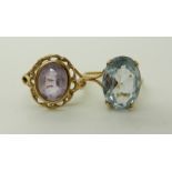 A yellow metal blue gem set ring, size Q1/2 and a 9ct gold amethyst ring (shank split) approx size