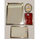 A lot comprising three rectangular silver photo frames, assorted marks, the largest 28cm x 20.5cm,
