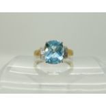 A 9ct gold checkerboard cut topaz and diamond accent ring, size P, weight 3gms Condition Report: