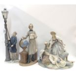 Three large Lladro groups including The Lamp Lighter, Shepherd and Shepherdess and a figure of a man