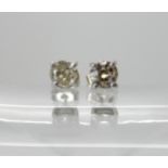 A pair of old cut diamond stud earrings, mounted in white metal (butterflies stamped 750), estimated