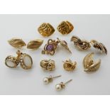 A collection of 9ct gold and yellow metal earrings to include opal set, Glasgow girls design set