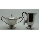 A silver cream and sugar by Adie Brothers Ltd, Birmingham 1963, the cream jug 13cm high, 682grams (