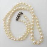 A string of baroque pearls with good lustre and a silver clasp, length 46cm, weight 14.7gms