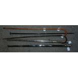 Three various walking canes and two white-metal scabbards (5) Condition Report: Available upon