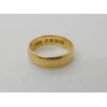 An 18ct gold wedding ring size M1/2, weight 3.7gms Condition Report: Available upon request