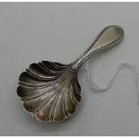 A silver caddy spoon with shell shaped bowl, Sheffield 1940, 8cm long Condition Report: Available