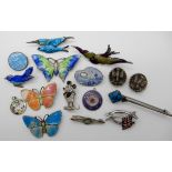 A group of silver and costume jewellery enamelled items to include and early Mickey Mouse brooch (no