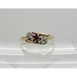 A 9ct gold ruby and diamond ring, size O1/2, weight 2gms Condition Report: Available upon request