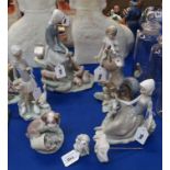 A Lladro figure of a girl with piglets, another of a girl with geese and five other Lladro figures