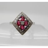 A 14k white gold ruby and diamond cluster ring, size P1/2, weight 4.2gms Condition Report: Available