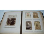 A Victorian photograph album with associated photographs, the album with white-metal lettering