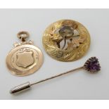 A 9ct gold Ward Brothers smoky quartz thistle brooch, a yellow metal heart shaped amethyst pin and a