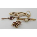 A 9ct gold Mackintosh style brooch, a 9ct ruby set brooch, a 9ct opal brooch and a yellow metal