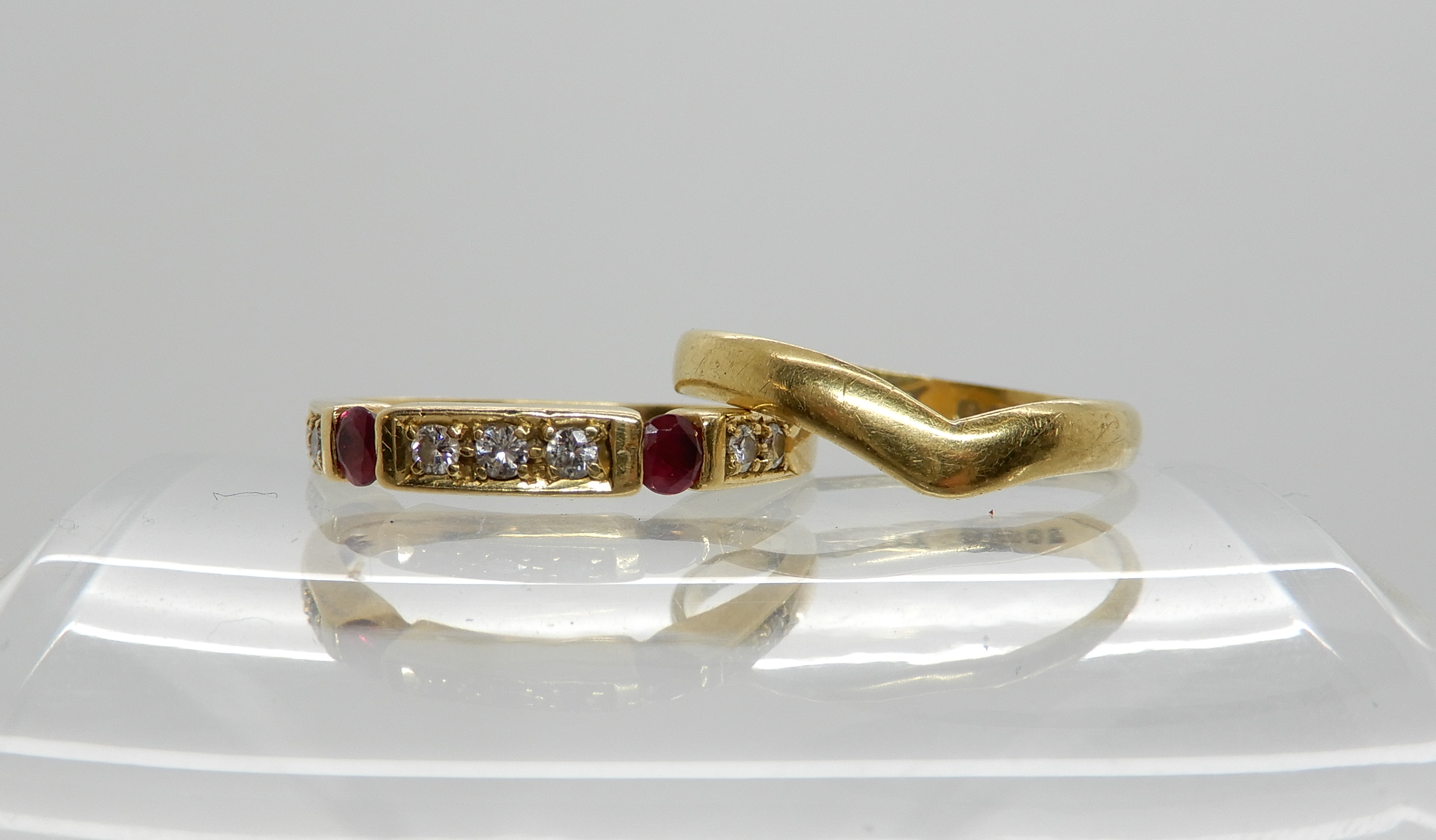 An 18ct gold ruby and diamond ring, size M1/2, together with a 18ct gold herringbone shaped