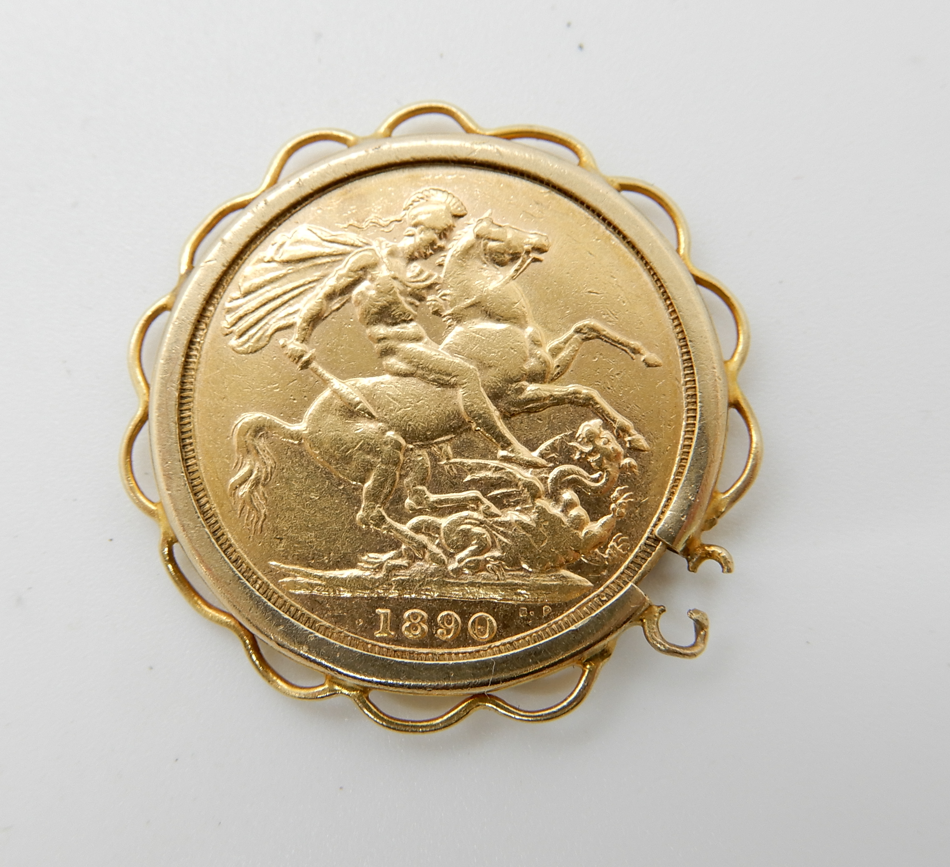 An 1890 full gold sovereign in 9ct gold pendant mount (af) combined weight 9.3gms Condition