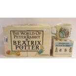 A complete box set "The World of Peter Rabbit" by Beatrix Potter together with a Wedgwood Peter