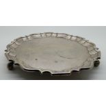 A silver card tray, probably by William Eaton, London 1834, of circular form with scalloped edge