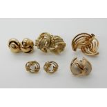 A collection of 9ct gold and yellow metal earrings to include large decorative knot earrings