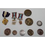 A lot comprising a Primrose League medal, two bronze medallions, a quantity of Masonic items etc