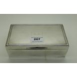 A silver cigarette box by Docker & Burn Limited, Birmingham 1927, monogrammed "D.D.", 16.5cm x 8cm