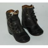 A pair of antique child's boots, 12cm long x 10cm high Condition Report: Available upon request