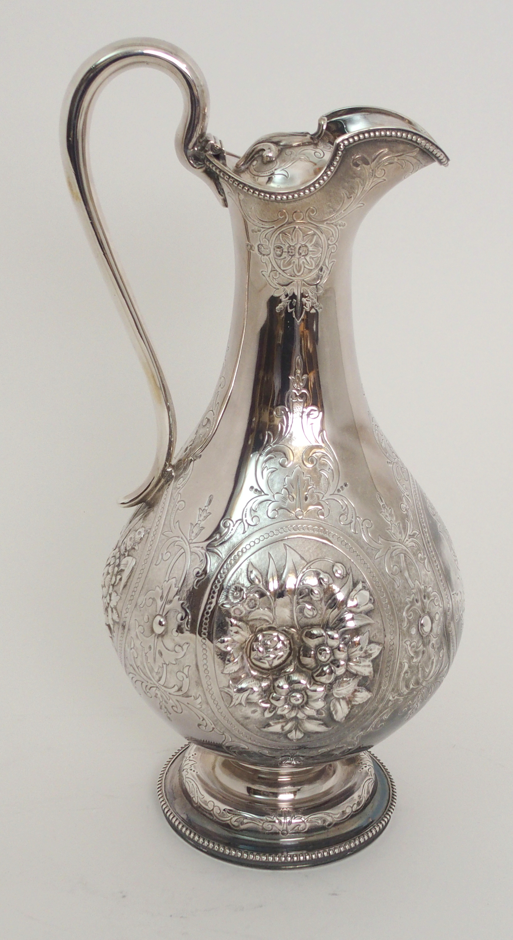 A VICTORIAN SILVER CLARET JUG by Harrison Brothers & Howson, London 1873, of baluster form with